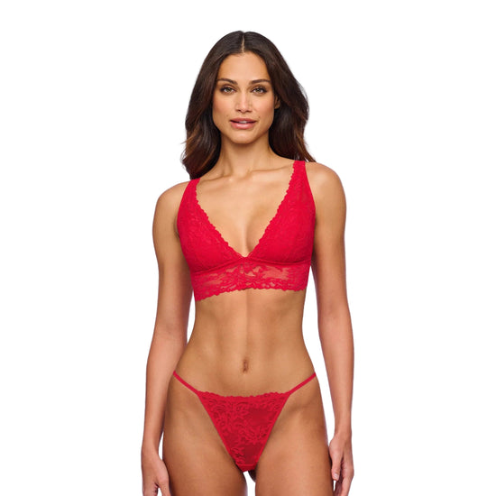 Woman wearing a red  bikini set on a white background