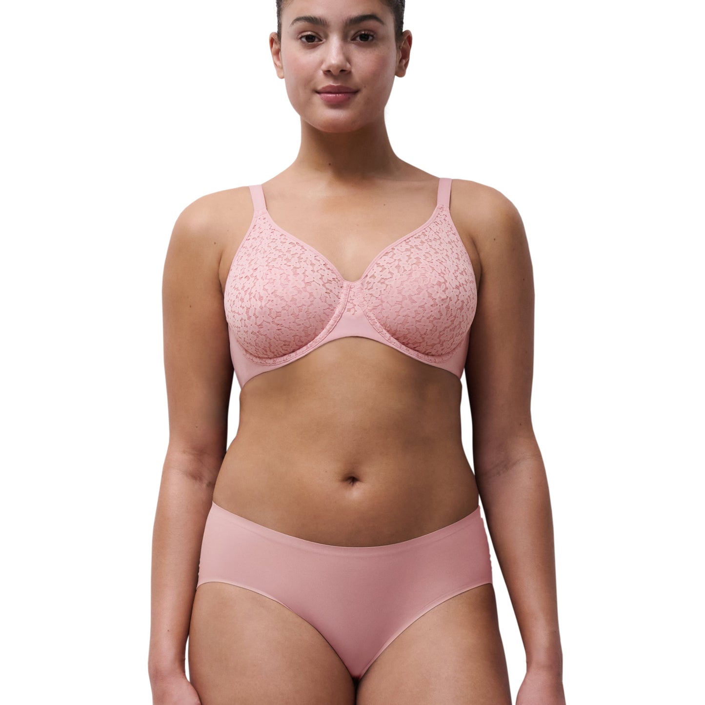 Woman wearing pink set on white background. 